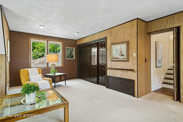 625 Greenbriar Ln, Lake Forest, IL 60045 - living area featuring wood walls, carpet floors, baseboards, and stairs