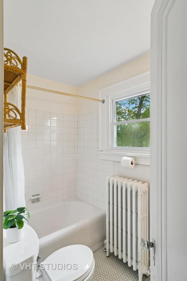 625 Greenbriar Ln, Lake Forest, IL 60045 - full bathroom with radiator heating unit, toilet, tile patterned flooring, and shower / washtub combination