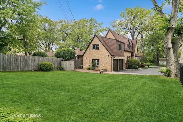 625 Greenbriar Ln, Lake Forest, IL 60045 - back of house with a garage, a chimney, driveway, and brick siding