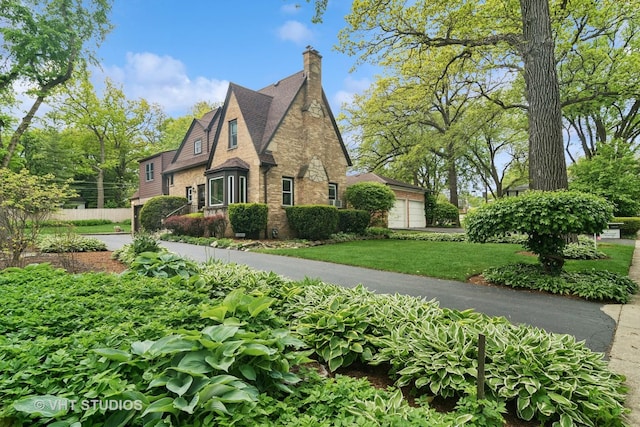 625 Greenbriar Ln, Lake Forest, IL 60045 - view of front of home featuring a chimney, brick siding, and a front yard