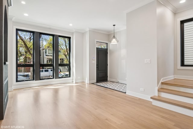 1928 W George St, Chicago, IL 60657 - entryway featuring light wood-style flooring, ornamental molding, recessed lighting, and stairs