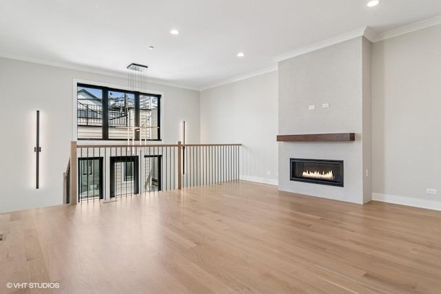 1928 W George St, Chicago, IL 60657 - unfurnished living room featuring a fireplace, wood finished floors, crown molding, and recessed lighting