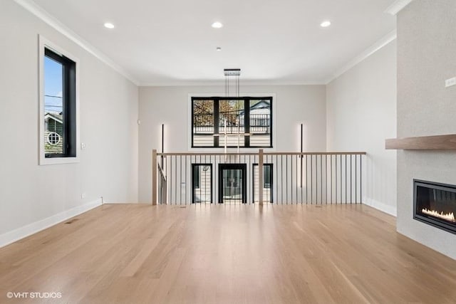1928 W George St, Chicago, IL 60657 - unfurnished living room featuring wood finished floors, a large fireplace, crown molding, and recessed lighting