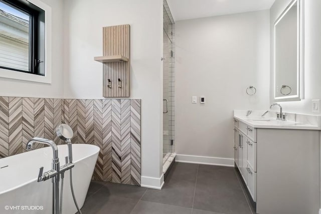 1928 W George St, Chicago, IL 60657 - bathroom with a stall shower, vanity, tile patterned flooring, a freestanding bath, and a wainscoted wall