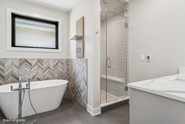 1928 W George St, Chicago, IL 60657 - bathroom featuring a shower stall, vanity, a soaking tub, tile patterned flooring, and a wainscoted wall