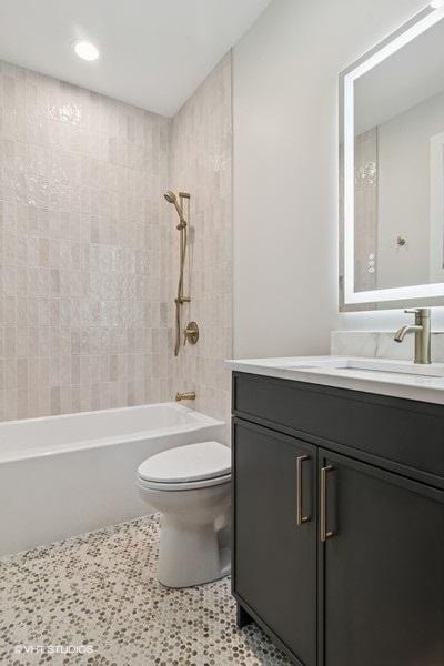 1928 W George St, Chicago, IL 60657 - bathroom with vanity, shower / tub combination, recessed lighting, and tile patterned floors
