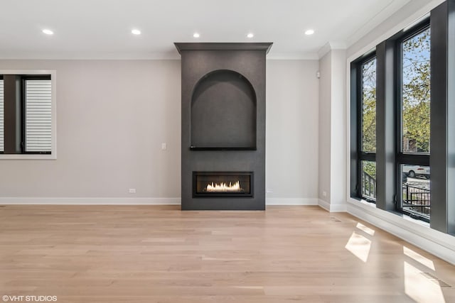1928 W George St, Chicago, IL 60657 - unfurnished living room featuring ornamental molding, light wood-style flooring, a fireplace, and recessed lighting