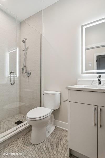 1928 W George St, Chicago, IL 60657 - bathroom with vanity, a stall shower, and tile patterned flooring