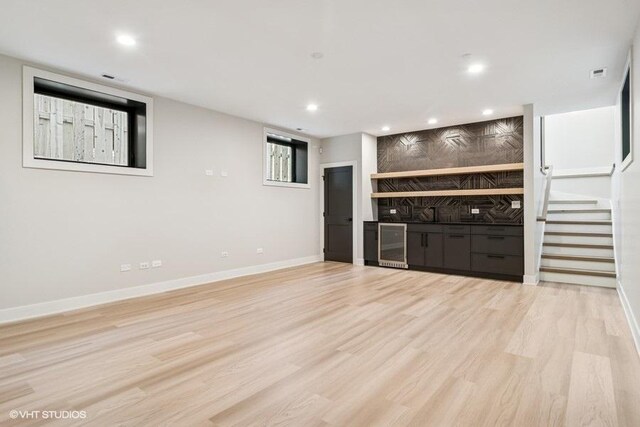 1928 W George St, Chicago, IL 60657 - bar with wine cooler, recessed lighting, light wood-style floors, stairs, and tasteful backsplash
