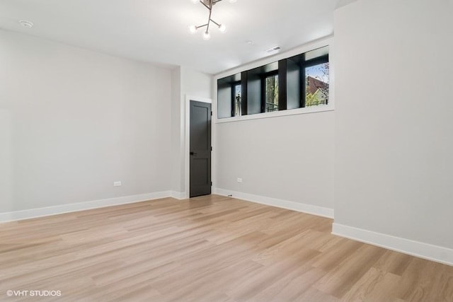 1928 W George St, Chicago, IL 60657 - spare room with light wood-style floors and baseboards