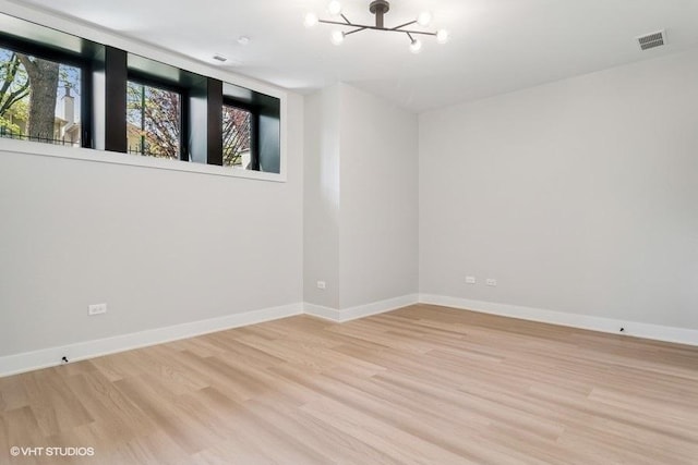 1928 W George St, Chicago, IL 60657 - unfurnished room featuring a chandelier and wood finished floors