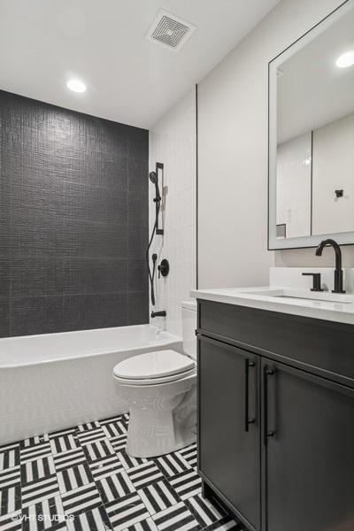 1928 W George St, Chicago, IL 60657 - full bathroom with vanity, shower / bathtub combination, and recessed lighting