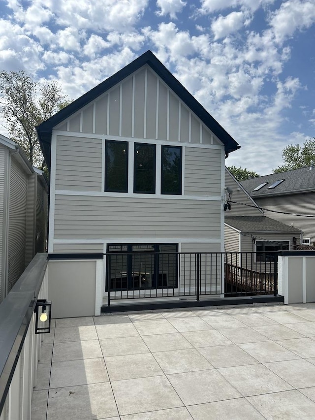1928 W George St, Chicago, IL 60657 - rear view of house with board and batten siding