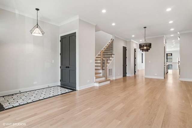1928 W George St, Chicago, IL 60657 - foyer entrance with ornamental molding, a chandelier, stairway, recessed lighting, and light wood-style floors