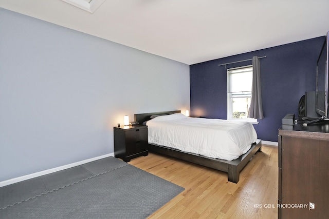 5201 Carriageway Dr Unit 311, Rolling Meadows, IL 60008 - bedroom with light wood-style floors and baseboards