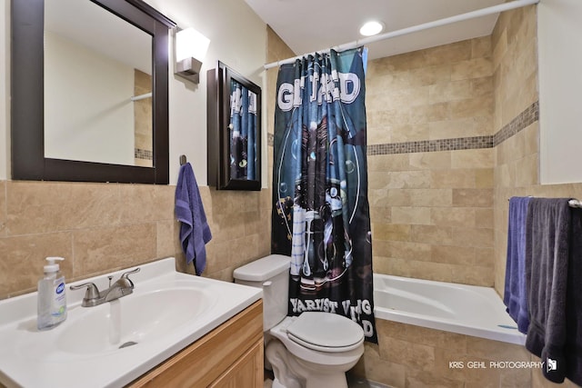 5201 Carriageway Dr Unit 311, Rolling Meadows, IL 60008 - bathroom featuring vanity, tile walls, toilet, and tiled shower / bath combo