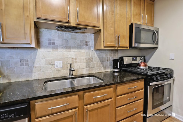 5201 Carriageway Dr Unit 311, Rolling Meadows, IL 60008 - kitchen with decorative backsplash, dark stone counters, brown cabinets, a sink, and stainless steel appliances