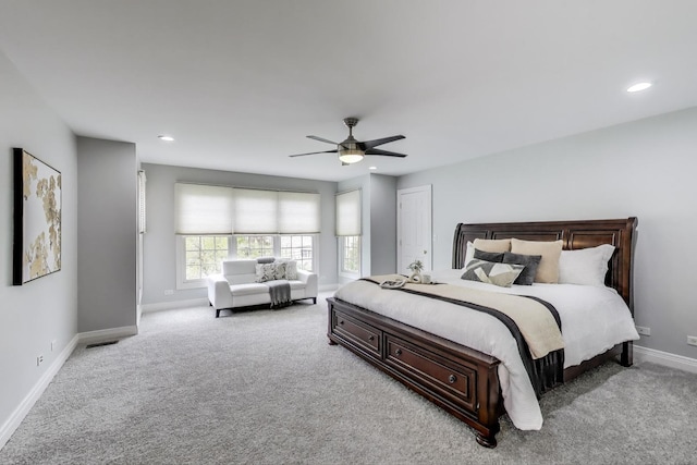 bedroom featuring baseboards, light carpet, ceiling fan, and recessed lighting