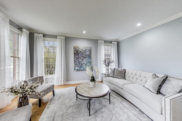 living area with light wood finished floors, baseboards, recessed lighting, and crown molding