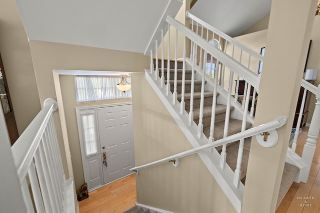 foyer entrance with wood finished floors and stairs
