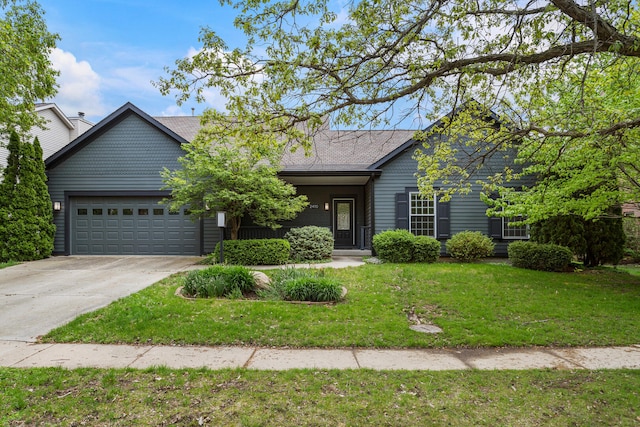 ranch-style home featuring a garage, driveway, and a front yard