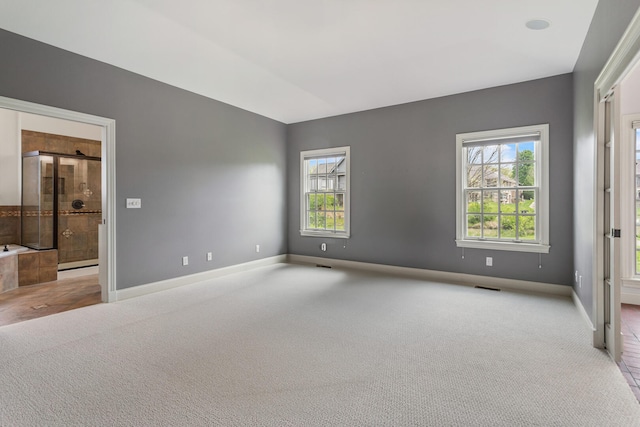 unfurnished bedroom featuring carpet flooring and baseboards