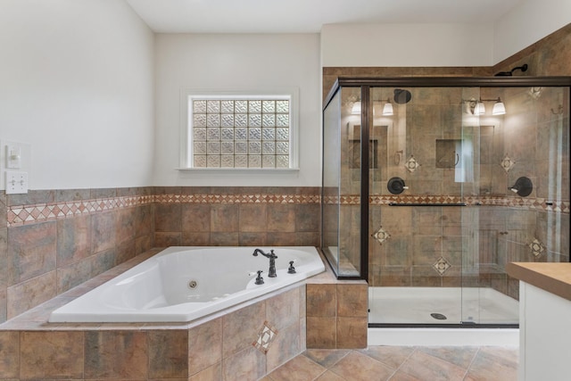 bathroom featuring a whirlpool tub and a stall shower