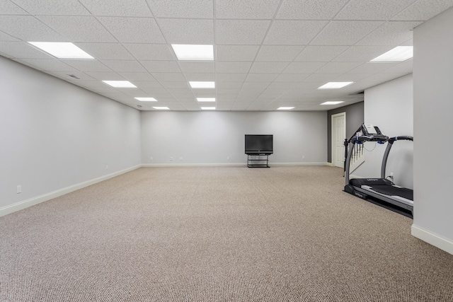 workout room with carpet flooring, a drop ceiling, and baseboards