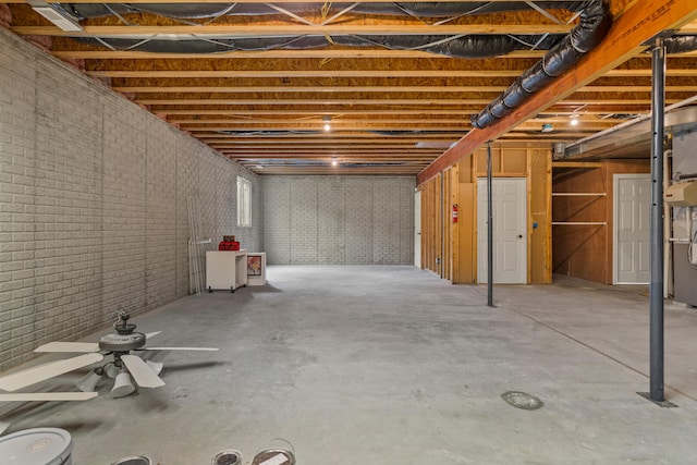 unfinished basement featuring a ceiling fan
