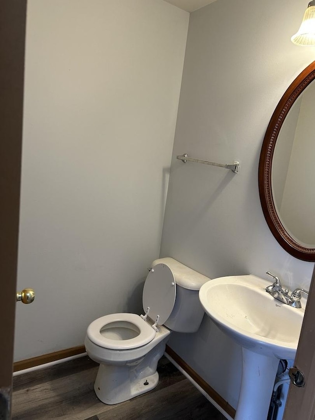 272 Aspen Cir, Gilberts, IL 60136 - bathroom featuring baseboards, wood finished floors, and toilet