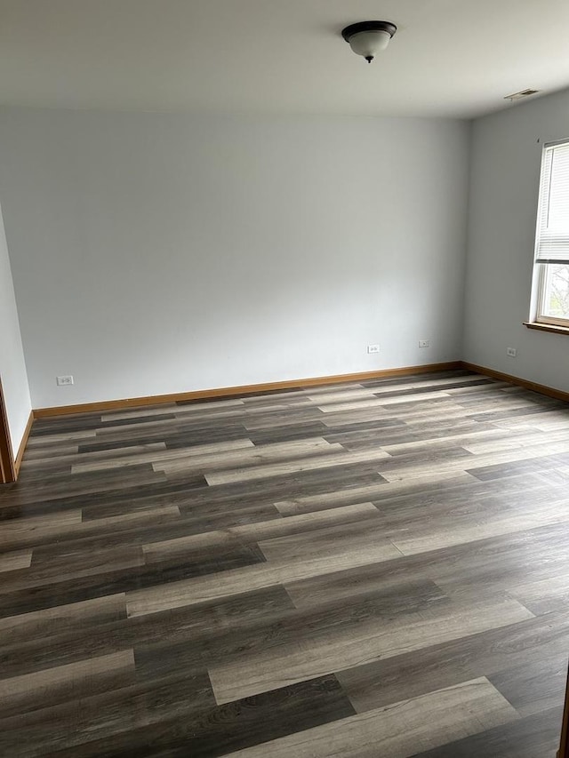 272 Aspen Cir, Gilberts, IL 60136 - empty room featuring visible vents, dark wood finished floors, and baseboards