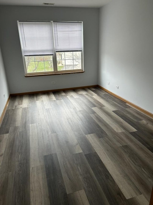 272 Aspen Cir, Gilberts, IL 60136 - unfurnished room with baseboards, visible vents, and wood finished floors