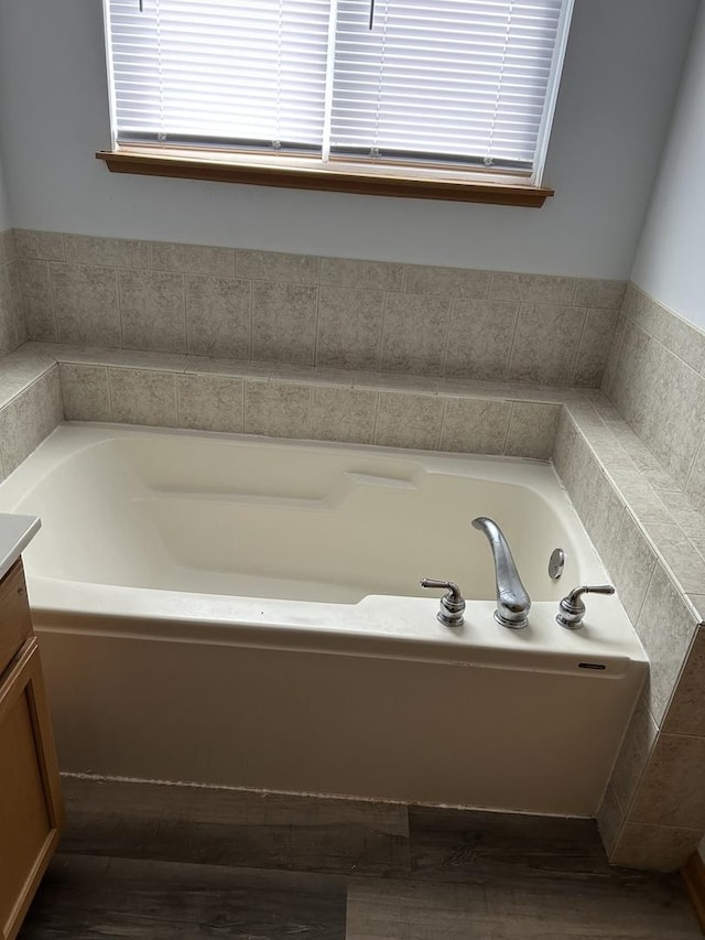 272 Aspen Cir, Gilberts, IL 60136 - bathroom with wood finished floors, a garden tub, and vanity