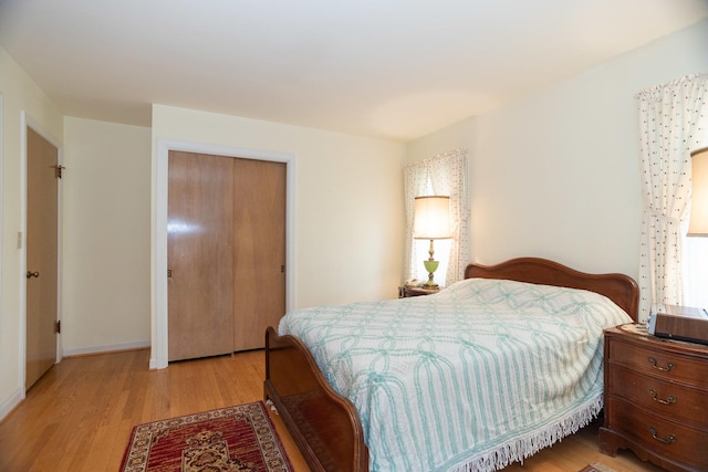 9450 Greenwood Ave, Des Plaines, IL 60016 - bedroom with light wood-style flooring, a closet, and baseboards