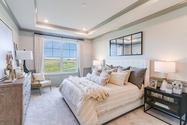 bedroom featuring crown molding, recessed lighting, a tray ceiling, and light carpet