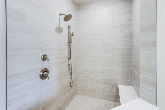bathroom with a tile shower