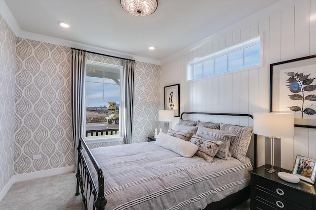 bedroom featuring baseboards, ornamental molding, carpet flooring, and wallpapered walls