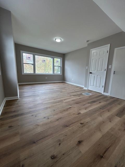 1473 Wentworth Ave, Calumet City, IL 60409 - unfurnished room with wood finished floors