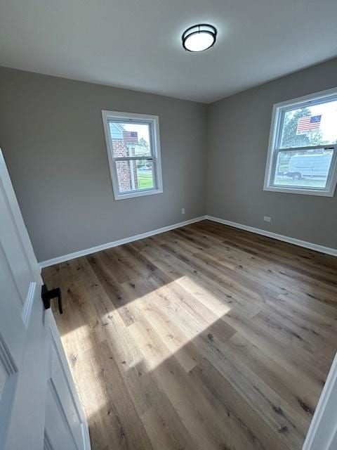 1473 Wentworth Ave, Calumet City, IL 60409 - empty room featuring wood finished floors and baseboards