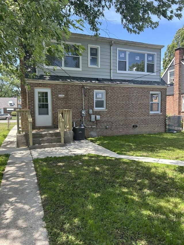 1473 Wentworth Ave, Calumet City, IL 60409 - back of house featuring brick siding and a patio area