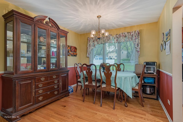 400 Illinois Rd, Frankfort, IL 60423 - dining room with a chandelier and light wood-style flooring