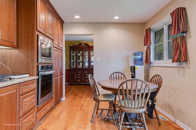 400 Illinois Rd, Frankfort, IL 60423 - kitchen featuring appliances with stainless steel finishes, light wood-style floors, brown cabinetry, and recessed lighting