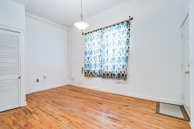 1449 N Artesian Ave, Chicago, IL 60622 - unfurnished dining area with baseboards, ornamental molding, and light wood finished floors