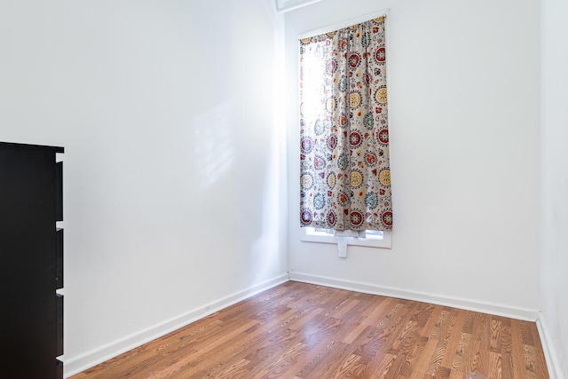 1449 N Artesian Ave, Chicago, IL 60622 - unfurnished room featuring baseboards and wood finished floors