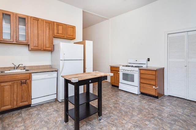 1449 N Artesian Ave, Chicago, IL 60622 - kitchen featuring brown cabinetry, a sink, and white appliances