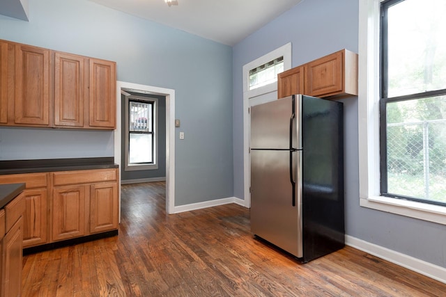 1449 N Artesian Ave, Chicago, IL 60622 - kitchen with dark countertops, baseboards, freestanding refrigerator, and dark wood-type flooring