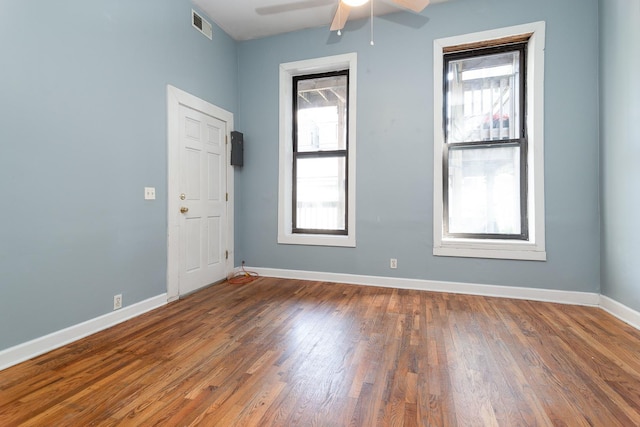 1449 N Artesian Ave, Chicago, IL 60622 - unfurnished room with baseboards, ceiling fan, wood finished floors, and visible vents