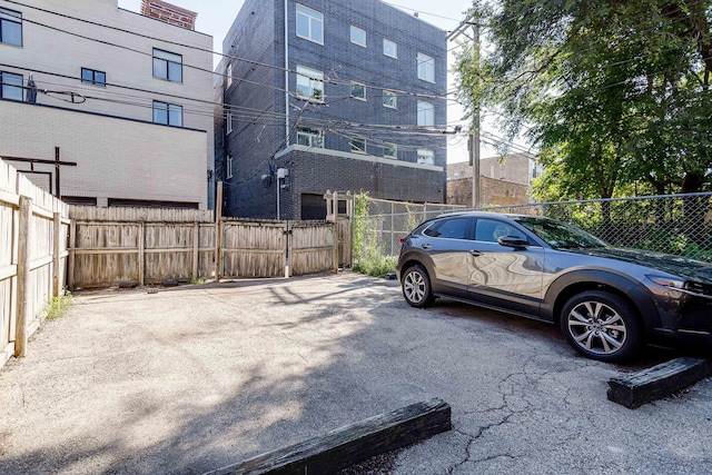 1449 N Artesian Ave, Chicago, IL 60622 - view of parking / parking lot featuring fence