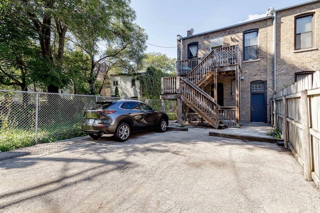 1449 N Artesian Ave, Chicago, IL 60622 - view of parking / parking lot featuring stairs and fence