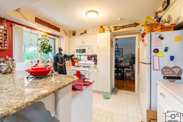 2312 Robertson Ln, Flossmoor, IL 60422 - kitchen featuring white appliances, light tile patterned floors, white cabinetry, and light stone counters